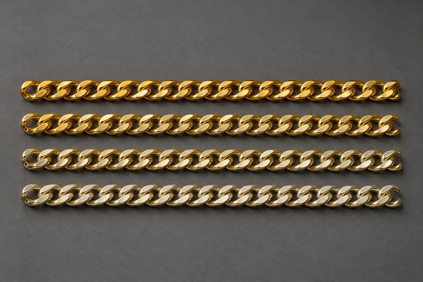 Four gold chain segments compared side by side showing 24K, 22K, 18K and 14K color differences